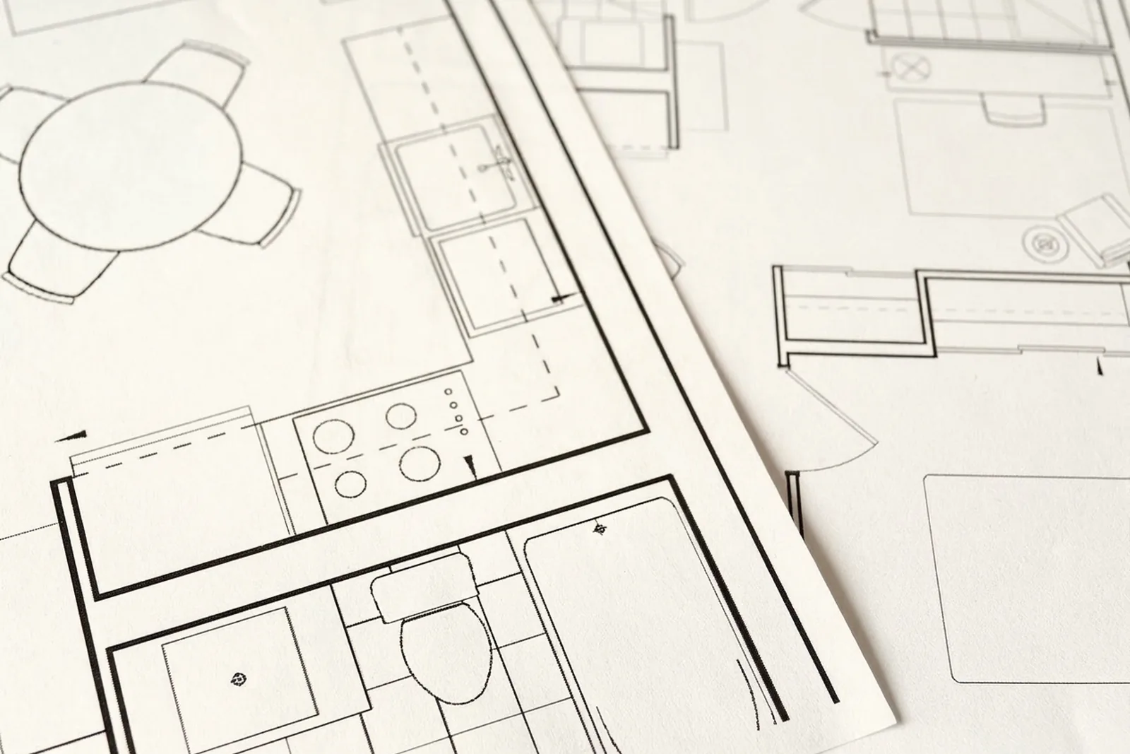 ADU floor plans and design samples on a table
